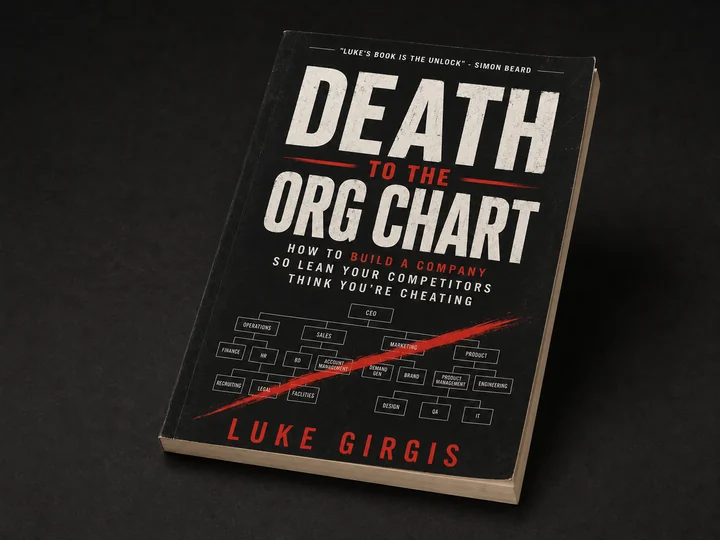 Flexible paperback edition of Death to the Org Chart with a visible cream page block